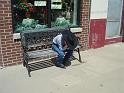 Young cowboy on a bench